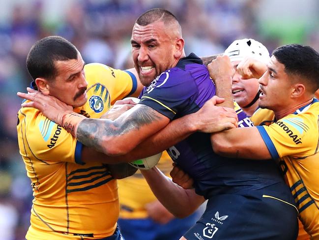 MELBOURNE, AUSTRALIA - MARCH 26:  Nelson Asofa-Solomona of the Storm is tackled during the round three NRL match between the Melbourne Storm and the Parramatta Eels at AAMI Park, on March 26, 2022, in Melbourne, Australia. (Photo by Kelly Defina/Getty Images)