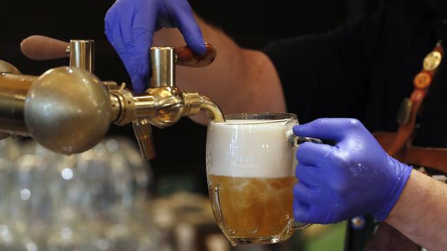 Best to book ahead for your weekend pub feed. Picture: AP Photo/Petr David Josek)