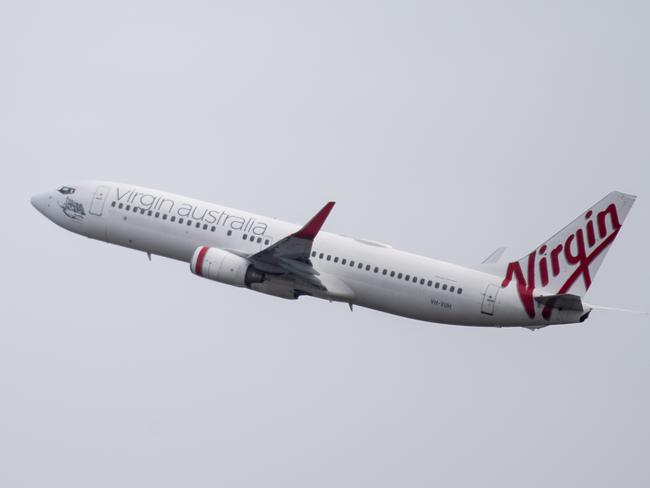 A Virgin Australia aircraft taking off. The boss of Queensland’s largest airport says it will take time for 2019 passenger levels to resume. Picture: NCA NewsWire / James Gourley