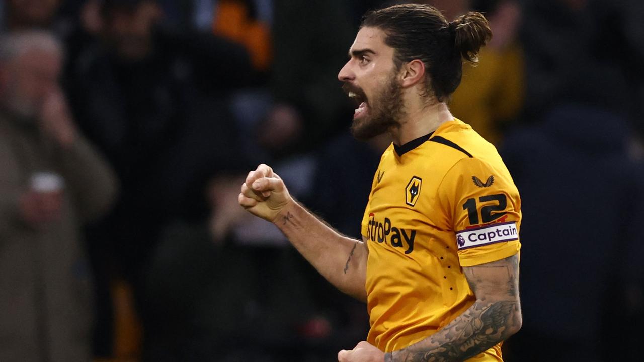 (FILES) Wolverhampton Wanderers' Portuguese midfielder Ruben Neves celebrates after scoring his team's third goal during the English Premier League football match between Wolverhampton Wanderers and Liverpool at the Molineux stadium in Wolverhampton, central England on February 4, 2023. Wolves captain Ruben Neves on June 23, 2023, became the latest major player to move to Saudi Arabia, the 26-year-old Portuguese international joining Al-Hilal. Neves leaves Wolves after six seasons for "a club record fee", the Premier League side announced, reported to be around 55 million euros. (Photo by DARREN STAPLES / AFP) / RESTRICTED TO EDITORIAL USE. No use with unauthorized audio, video, data, fixture lists, club/league logos or 'live' services. Online in-match use limited to 120 images. An additional 40 images may be used in extra time. No video emulation. Social media in-match use limited to 120 images. An additional 40 images may be used in extra time. No use in betting publications, games or single club/league/player publications. /