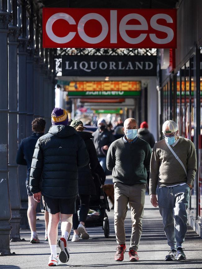 Retail and hospitality staff must continue to wear masks while at work. Picture: Ian Currie