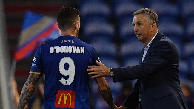 Roy O’Donovan with Newcastle boss Ernie Merrick. Picture: AAP