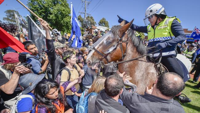 Mounted police clash with protesters in Melton. Picture: Jason Edwards