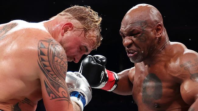 ARLINGTON, TEXAS - NOVEMBER 15: (L-R) Jake Paul and Mike Tyson fight during LIVE On Netflix: Jake Paul vs. Mike Tyson at AT&T Stadium on November 15, 2024 in Arlington, Texas. (Photo by Sarah Stier/Getty Images for Netflix Ã&#130;Â© 2024)