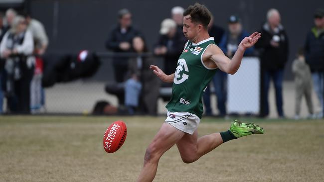 Greensborough captain Jack Johnston gets a kick. Picture: Andrew Batsch