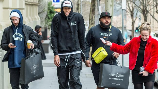 Ben Simmons and his entourage walk through Melbourne’s CBD after shopping at Culture Kings. Picture: Jake Nowakowski