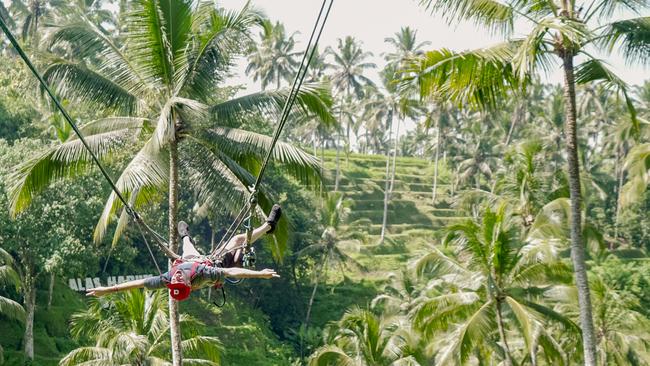 Matty Holdsworth enjoying ine of the high-flying swings in Ubud over stunning rice fields.