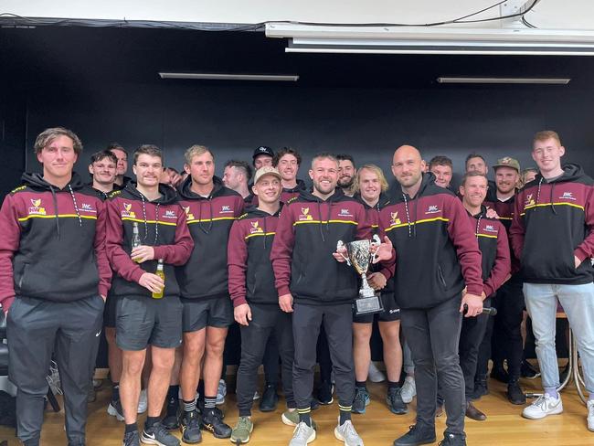 NWFL celebrate with the trophy after accounting for NTFA at Devonport Oval on Saturday.