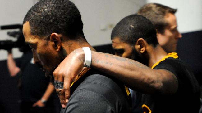 JR Smith and Kyrie Irving walk to the locker room after the defeat. Picture: AFP