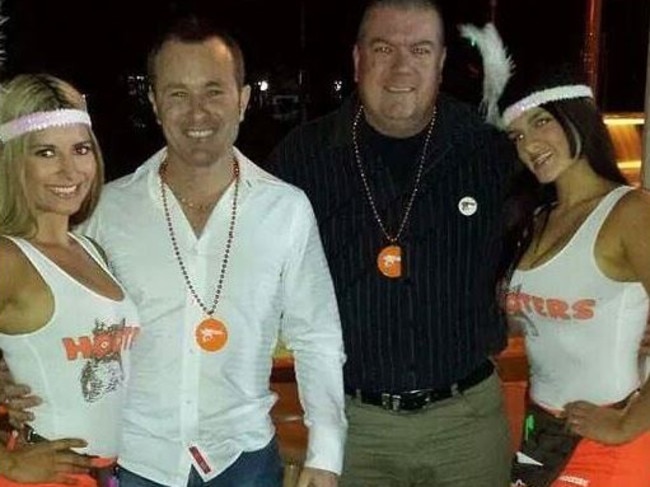 Dan Shearing above with Hooters’ girls pleaded guilty to harassing his late girlfriend whose bank account he tried to access after her death.