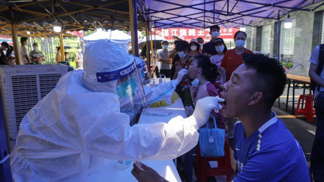 A man receives a nucleic acid test for the Covid-19 coronavirus in Guangzhou in China's southern Guangdong province during the latest outbreak. Picture: AFP