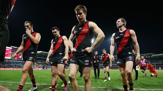 Dejected Bombers players walk from the field after their loss to Sydney. Picture: Getty Images