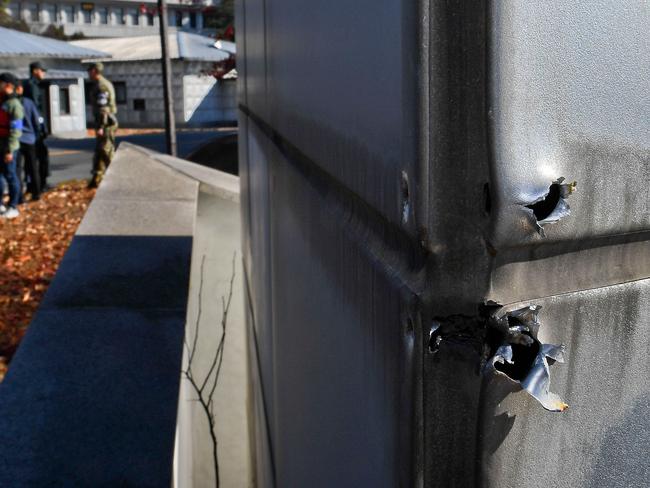 Bullet holes are seen near a spot where a North Korean has defected crossing the border in Panmunjom, South Korea. Picture: Getty Images