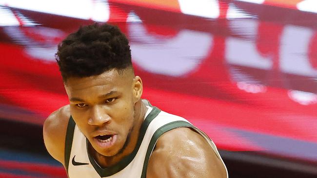 MIAMI, FLORIDA - DECEMBER 29: Giannis Antetokounmpo #34 of the Milwaukee Bucks reacts after a dunk against the Miami Heat during the first quarter at American Airlines Arena on December 29, 2020 in Miami, Florida. NOTE TO USER: User expressly acknowledges and agrees that, by downloading and or using this photograph, User is consenting to the terms and conditions of the Getty Images License Agreement. Michael Reaves/Getty Images/AFP == FOR NEWSPAPERS, INTERNET, TELCOS &amp; TELEVISION USE ONLY ==