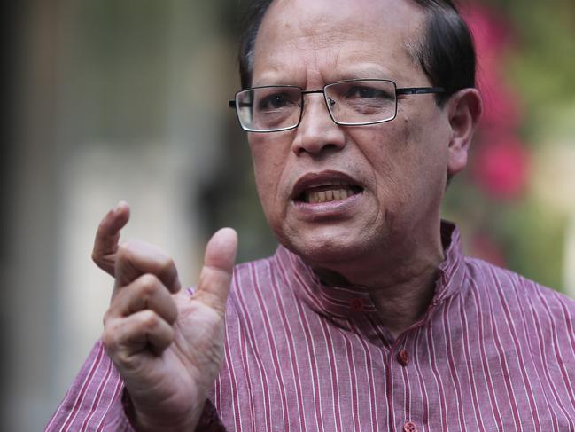 Bangladesh Bank Governor Atiur Rahman who resigned Tuesday gestures as he speaks during a press conference in Dhaka, Bangladesh, Tuesday, March 15, 2016. The head of Bangladesh's central bank resigned on Tuesday, after hackers managed to divert $101 million from the country's account with the Federal Reserve Bank in New York. (AP Photo/ A.M. Ahad)