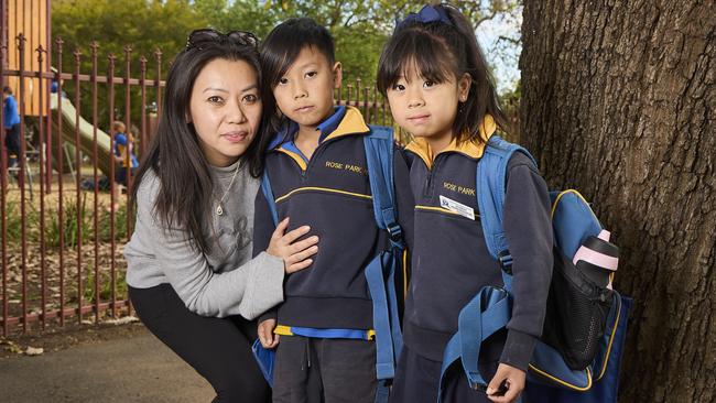 Thuy Dinhpham with her son Blake Lim, 8, and daughter, Mika Lim, 6, outside Rose Park Primary School. Picture: Matt Loxton