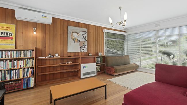 Modern comforts like split system heating and cooling have been installed, alongside sympathetic mid-century light fitting.