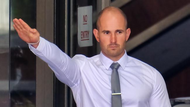 Thomas Sewell, a white nationalist who punched a security guard outside Channel 9's Docklands studio in 2021, performed a Nazi salute outside Melbourne Magistrates court. Picture: NCA NewsWire / Luis Enrique Ascui