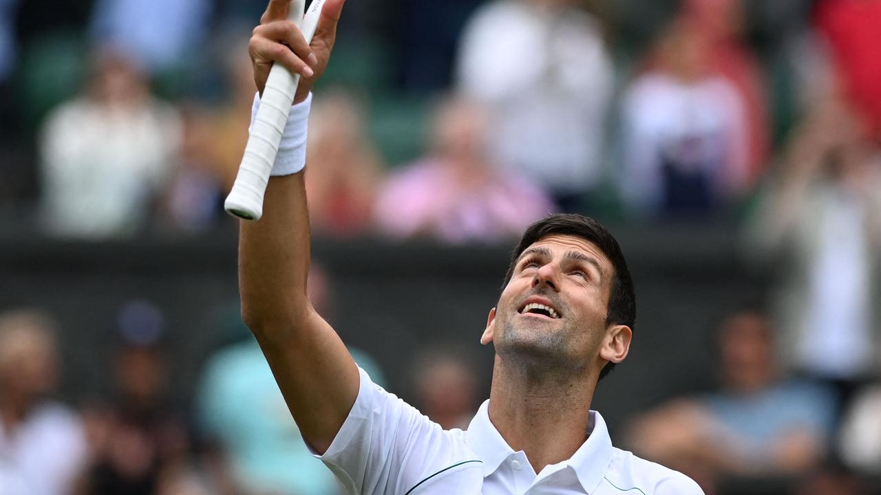 Serbia's Novak Djokovic celebrates beating Serbia's Miomir Kecmanovic during their men's singles tennis match on the fifth day of the 2022 Wimbledon Championships at The All England Tennis Club in Wimbledon, southwest London, on July 1, 2022. (Photo by Glyn KIRK / AFP) / RESTRICTED TO EDITORIAL USE