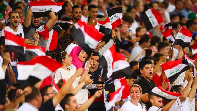 Iraq supporters cheer their team on against Japan.