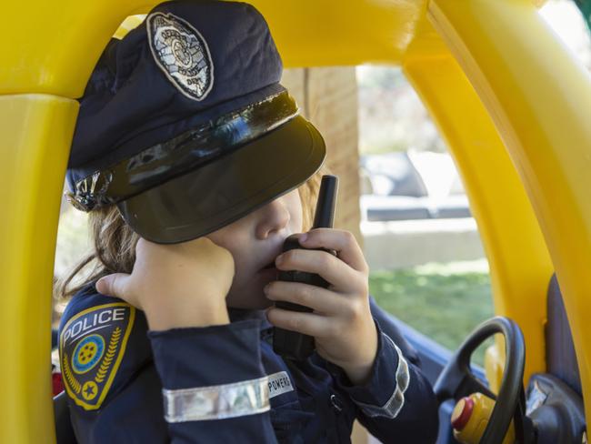 4 year old boy dressed as a police officer