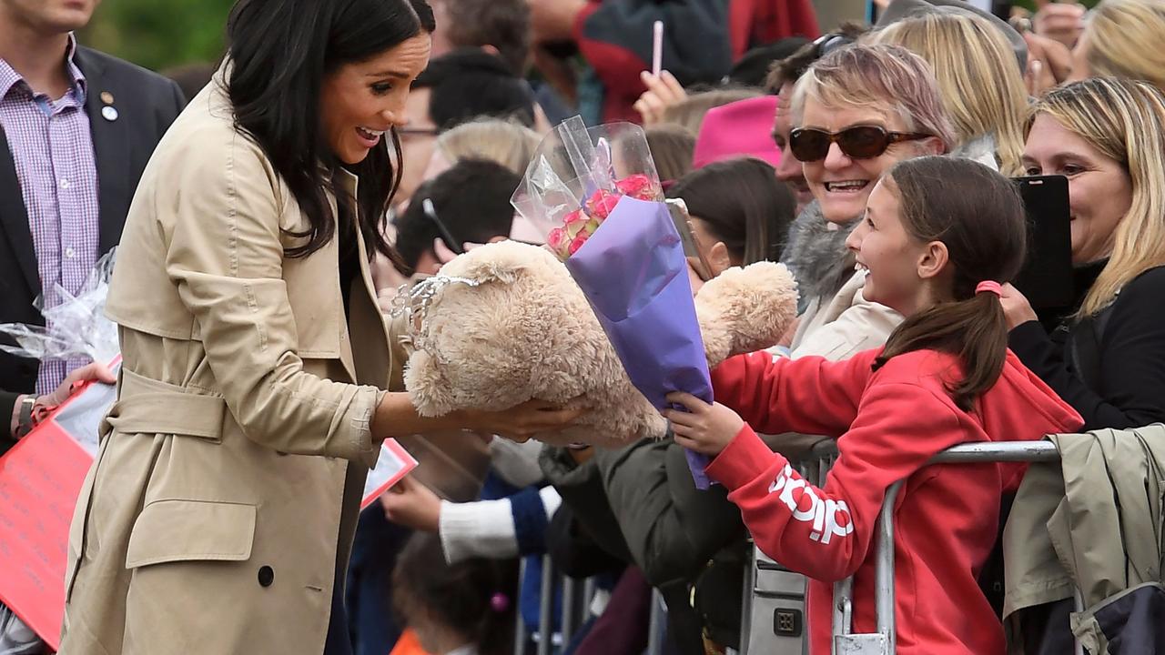 The Duchess of Sussex greets children on a public walk in Melbourne. Picture: William West.