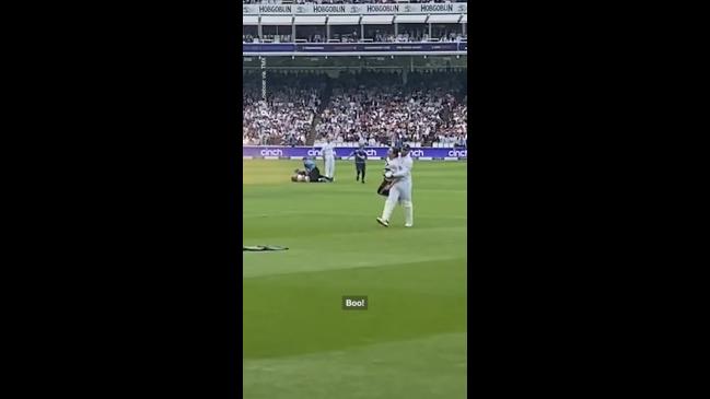 Protester carried off cricket pitch