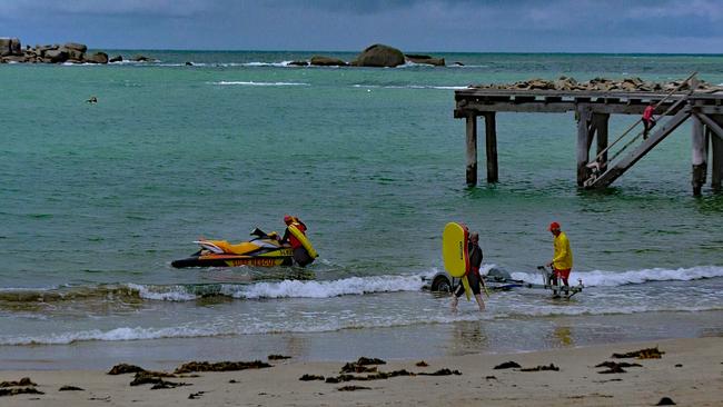 Surf lifesavers at Horseshoe Bay, Port Elliot, on Saturday, where a man drowned. Picture: Gary Juleff