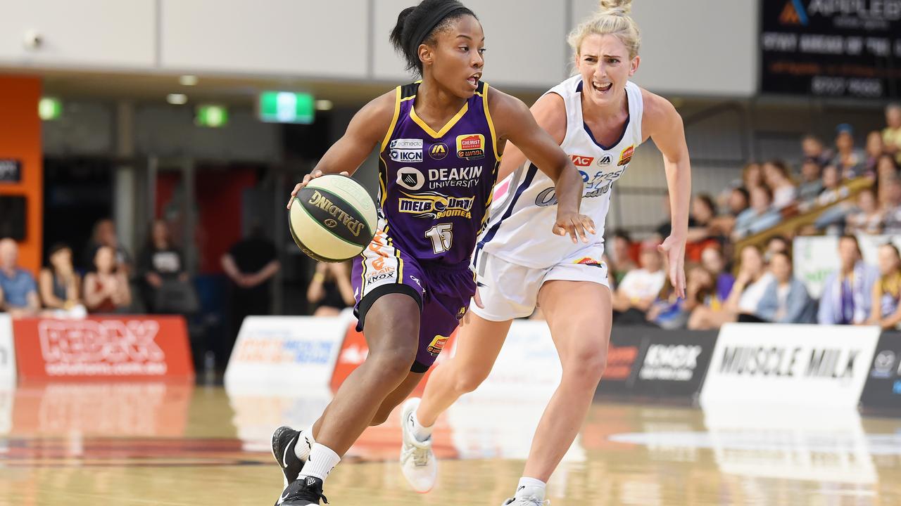 Melbourne Boomers Lindsay Allen is pressured by Adelaide Lightning’s Lauren Nicholson at the State Basketball Centre in Melbourne. Picture: Lawrence Pinder