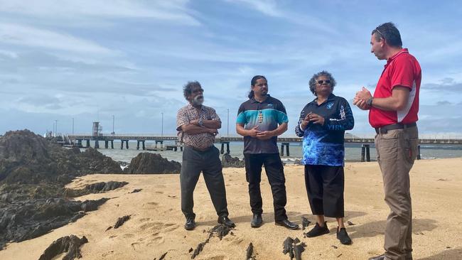 Aboriginal and Torres Strait Islander Partnerships Minister Craig Crawford speaks with Traditional Owner George Singleton, Dawul Wuru Aboriginal Corporation project manager Gavin Singleton and Indigenous health worker Mercy Baird at the Palm Cove jetty last week. Picture: Peter Michael