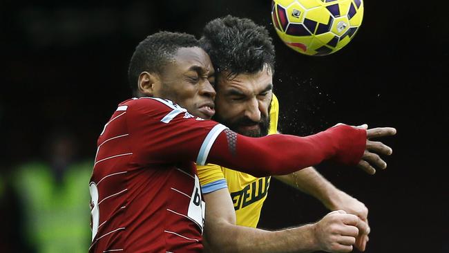 West Ham's Diafra Sakho, left, in action with Crystal Palace's Mile Jedinak during the English Premier League soccer match between West Ham United and Crystal Palace at the Boleyn Ground in London, Saturday, Feb. 28, 2015. (AP Photo/Kirsty Wigglesworth)