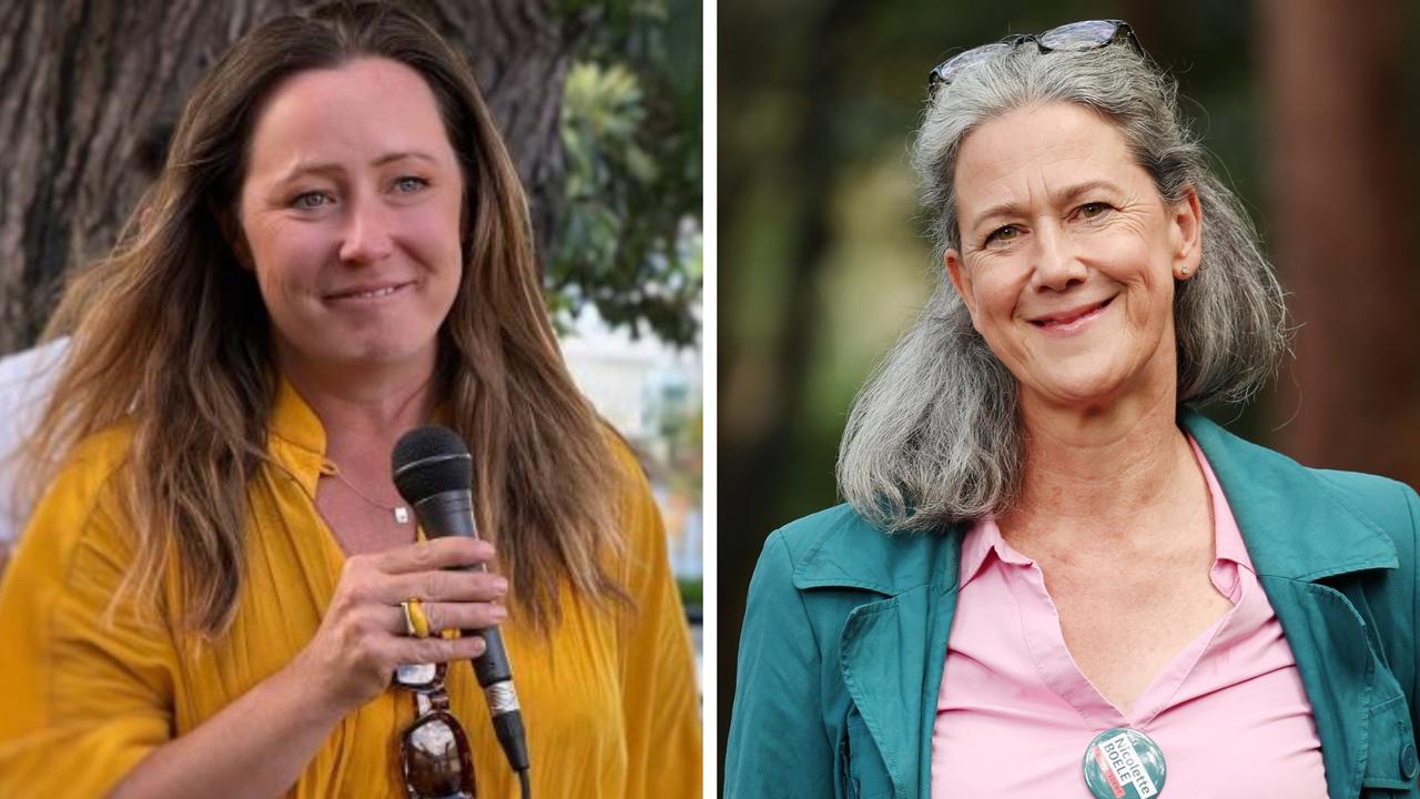 Teals share notes in campaign sign stare-downs