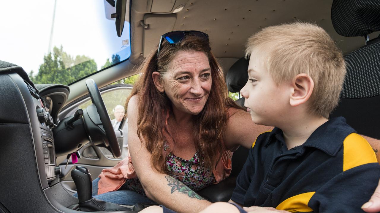 Jax and mum Deanne Carey in their 2004 Holden Commodore donated by Cheap Cars Toowoomba, in conjunction with Lifeline. Picture: Kevin Farmer