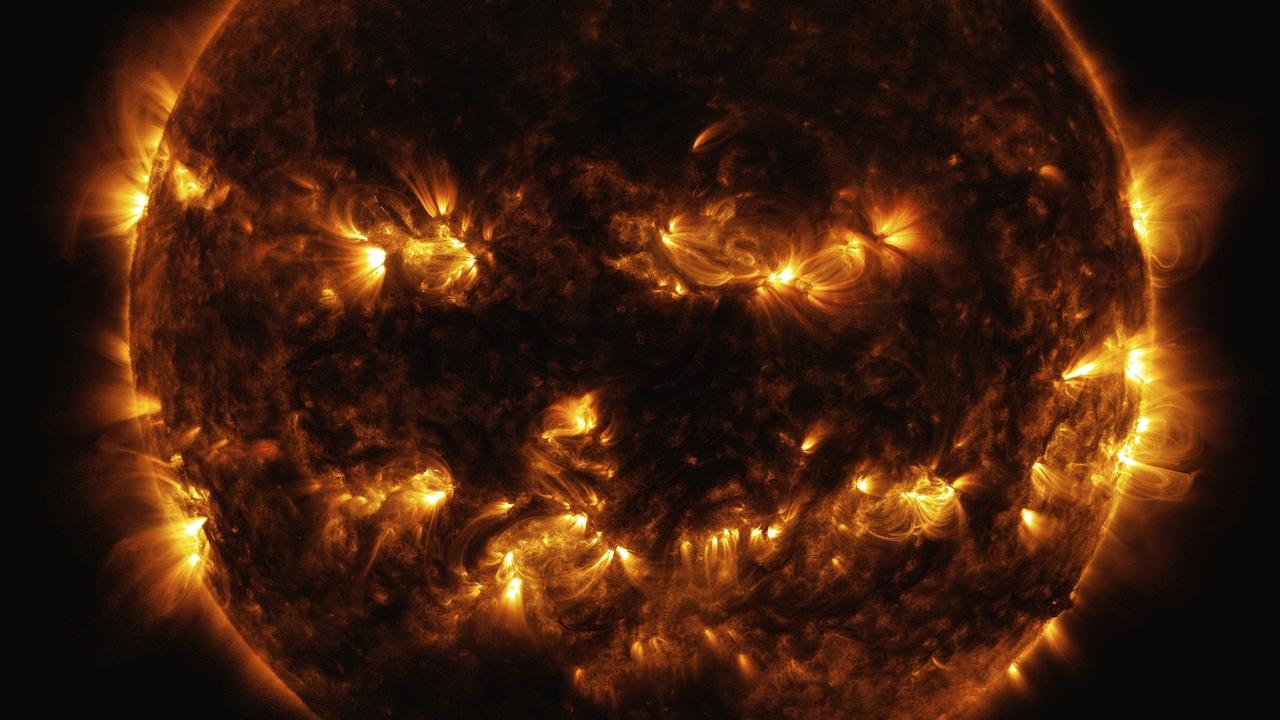 Active regions on the Sun combine to look like a jack-o’-lantern face. The image was captured by NASA's Solar Dynamics Observatory, which watches the Sun from its orbit in space. Picture: NASA via AP