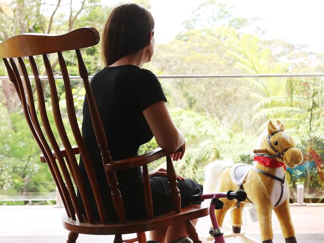 23/12/22: The mother forced to hand over her 2-year-old daughter into the hands of her allegedly abusive father who is set to take the infant to Europe in the next 12 hours. She is pictured with the rocking horse she was given for Xmas. John Feder/The Australian.