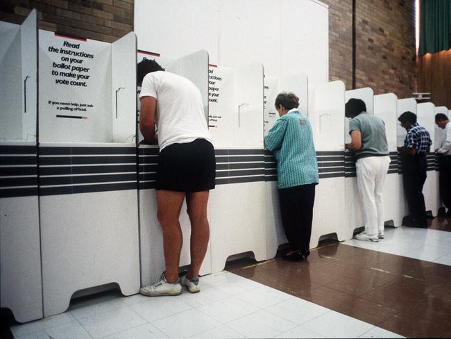 1996. Voters line up at election booths. Polling booth. Voting. Election.