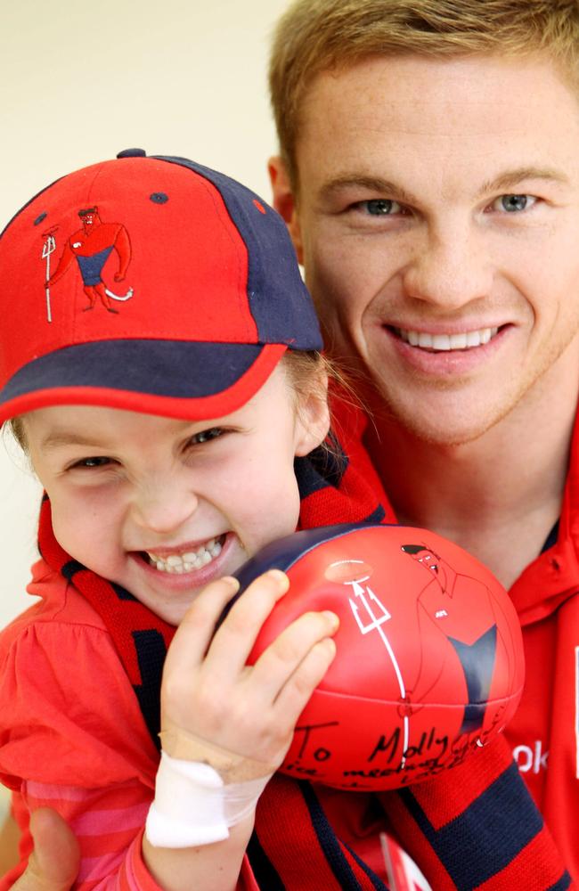 Colin Sylvia always put his hand up to visit sick kids. In this 2006 pic he is with Molly Bryant from Bendigo.