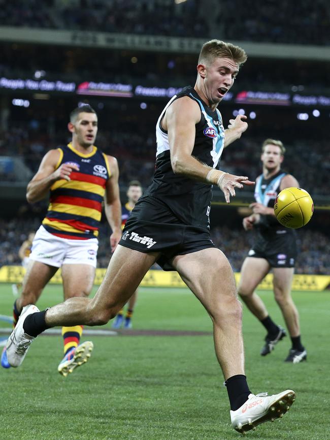 Dougal Howard blasts a kick away against Adelaide. Picture Sarah Reed