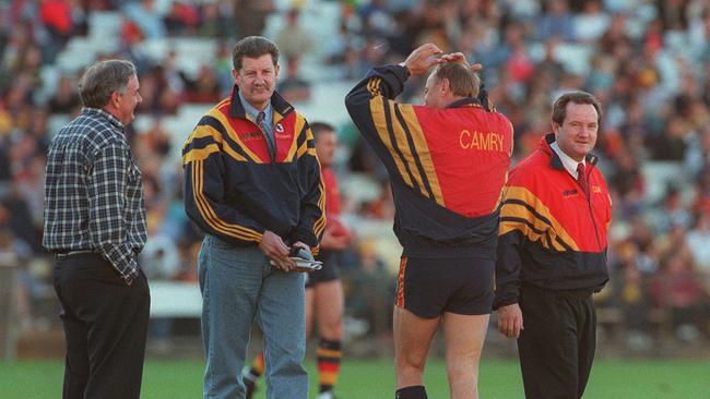 Former Crows coach Malcolm Blight, third from left, with Bob Hammond, Terry Moore, and operations manager John Reid at Adelaide Crows training session during grand final week in 1997.