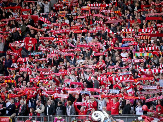 Liverpool fans launch into a rendition of You’ll Never Walk Alone.