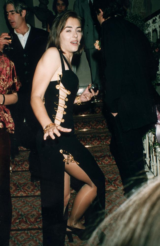 Pinned together. Elizabeth Hurley at the London post-premiere party of her then-boyfriend Hugh Grant's film, Four Weddings and a Funeral. Picture: Getty Images