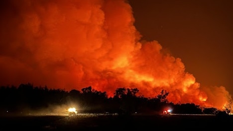 Morley's Earthmoving's excavator creating a containment line for the fire brigade in Cranbrook. Photo: Tom Warren