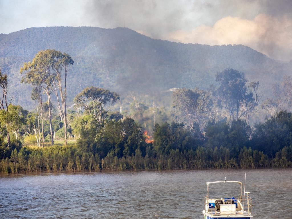 Firefighters are at the scene of a vegetation fire that is in inaccessible country at The Common along the Fitzroy River with the smoke blowing across the water into Depot Hill.