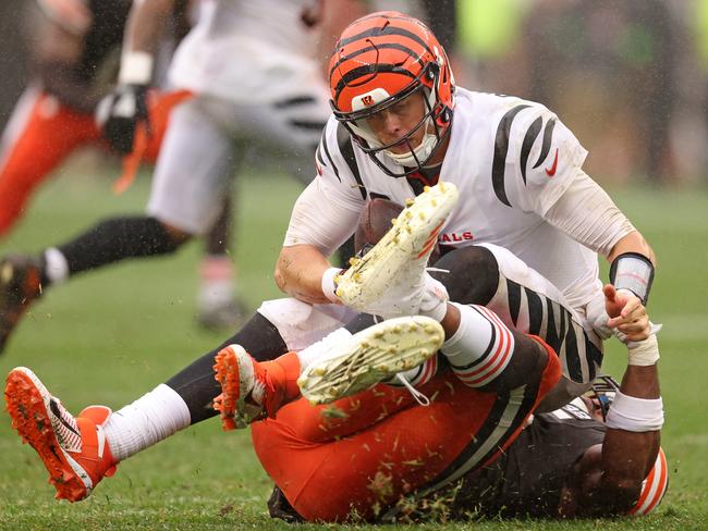 CLEVELAND, OHIO - SEPTEMBER 10:  Joe Burrow #9 of the Cincinnati Bengals is sacked by Myles Garrett #95 of the Cleveland Browns during the second half at Cleveland Browns Stadium on September 10, 2023 in Cleveland, Ohio. (Photo by Gregory Shamus/Getty Images)