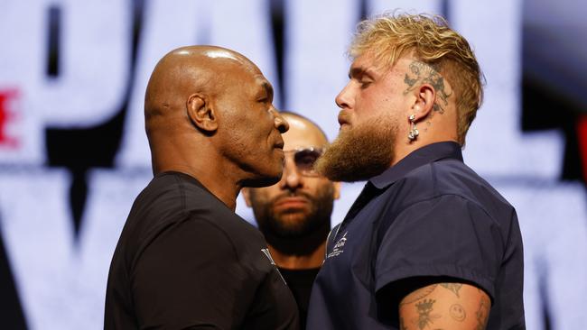 NEW YORK, NEW YORK - MAY 13: (L-R) Mike Tyson and Jake Paul speak onstage at the press conference in promotion for the upcoming Jake Paul vs. Mike Tyson boxing match at The Apollo Theater on May 13, 2024 in New York City. (Photo by Sarah Stier/Getty Images for Netflix)