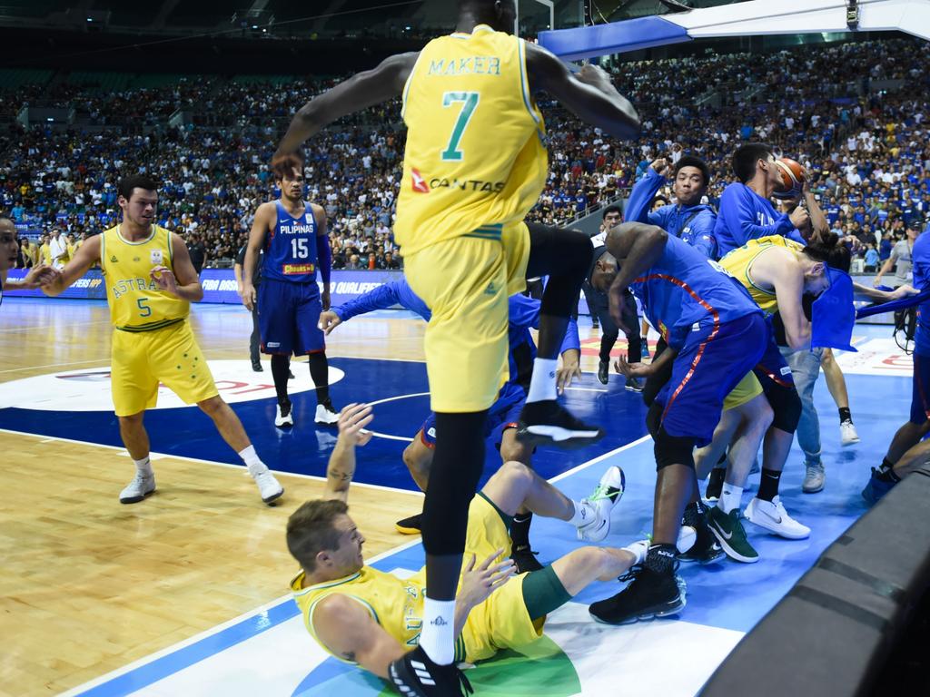 Players from benches run to their teammates who figured in a brawl during the match between Australia and the Philippines for the FIBA Asian Qualifiers held at the Philippine Arena in the province of Bulacan, north of Manila in 02 July 2018. Australia beat the Philippines by default following a brawl in the third quarter that shocked basketball fans all over the world. (Photo by George Calvelo/NurPhoto via Getty Images)