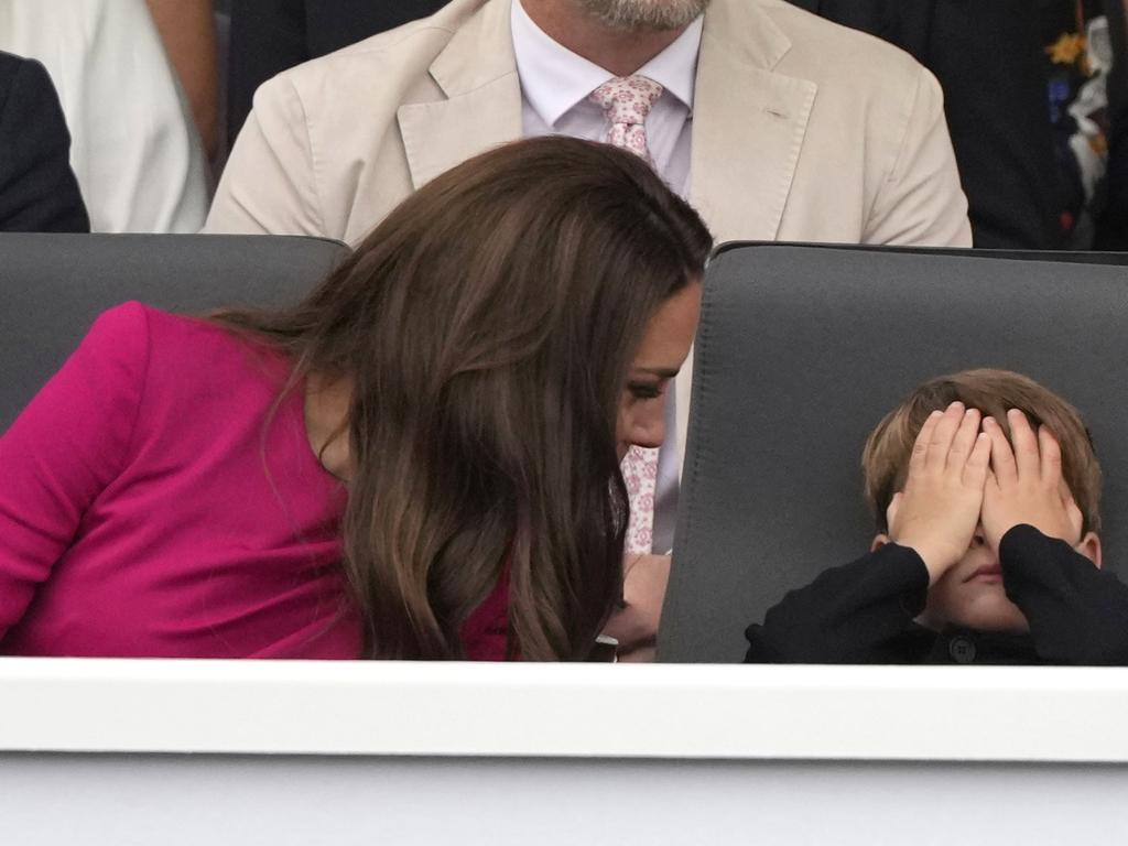 The Duchess chats to a restless Prince Louis. Picture: Getty Images