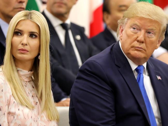 Advisor to the US President Ivanka Trump (L) sits next to her father US President Donald Trump during an event on the theme "Promoting the place of women at work" on the sidelines of the G20 Summit in Osaka on June 29, 2019. (Photo by Dominique JACOVIDES / POOL / AFP)