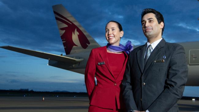 Virgin Australia and Qatar Airways crew with a Qatar Airways 777 at Brisbane Airport. Picture: James D. Morgan/Getty Images