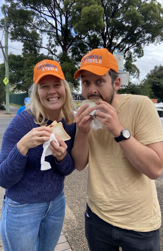 Georgia Steele voters Sarah Willetts and Heath Tollis donned volunteers’ caps to show their support for the independent before grabbing a sausage sizzle. Picture: Ashleigh Tullis